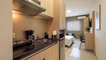 Standard Suite, 1 Queen Bed | Private kitchen | Mini-fridge, microwave, dishwasher, toaster