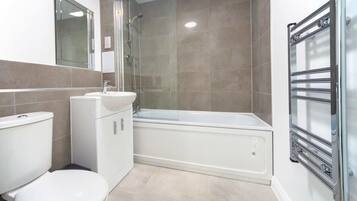 Bathtub, hair dryer, towels