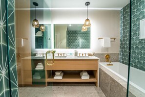 Separate tub and shower, rainfall showerhead, hair dryer, bathrobes