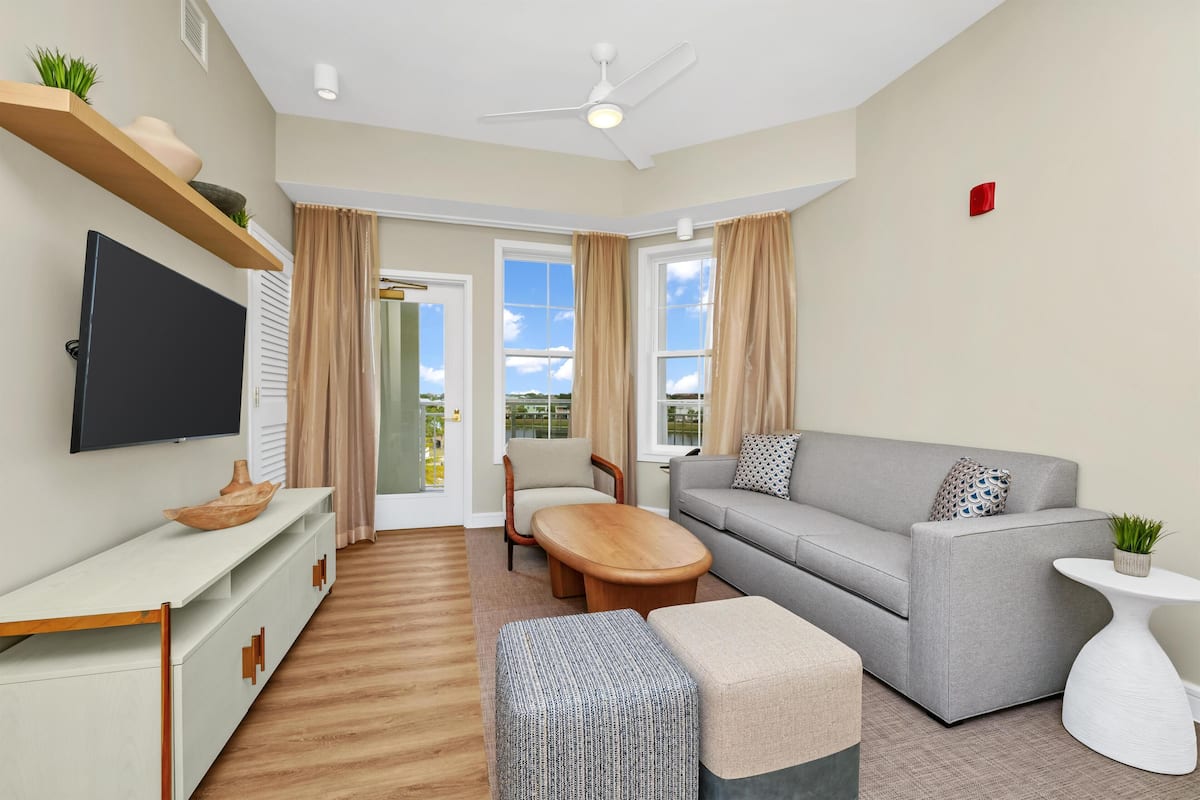 Suite, 2 Bedrooms, Corner | Living area | 50-inch LCD TV with cable channels