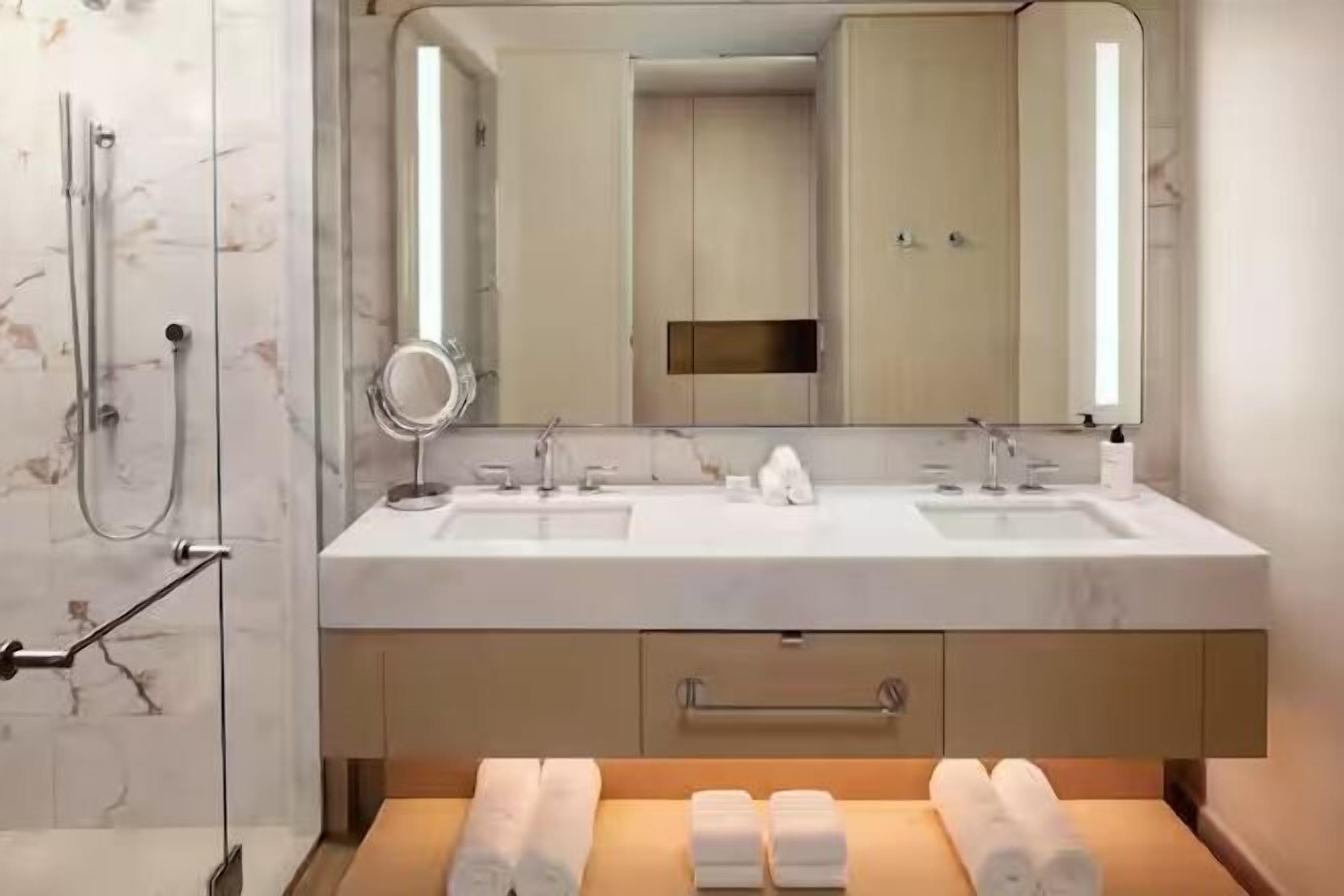 Designer toiletries, hair dryer, bathrobes, slippers