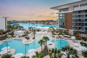 Outdoor pool, cabanas (surcharge), pool umbrellas at Conrad Orlando at Evermore