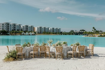 Private beach, white sand, beach cabanas, sun loungers at Conrad Orlando at Evermore