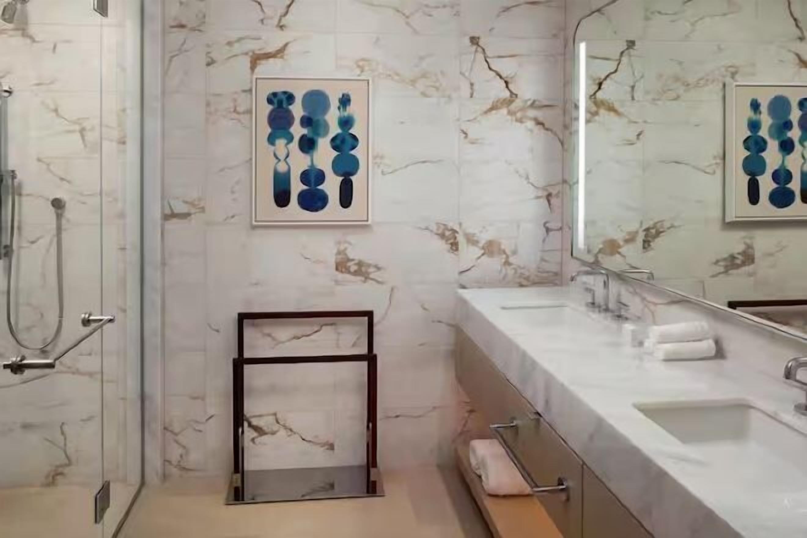 Designer toiletries, hair dryer, bathrobes, slippers