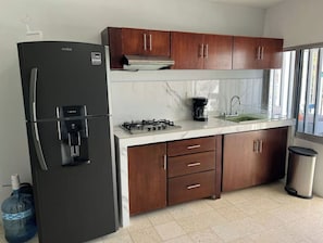 Fridge, oven, coffee/tea maker, cookware/dishes/utensils