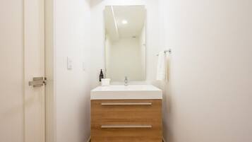 Bathtub, hair dryer, towels, soap