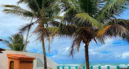Feet in the sand at Garça beach in Maceió-AL