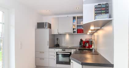 Bright, modern ground floor apartment for 4 people including four-legged friends