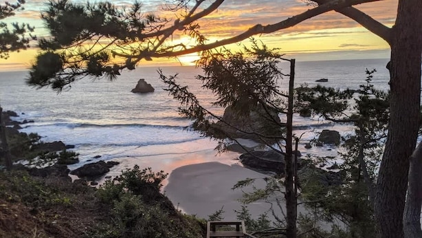 A wooden staircase leading to a beach with a sunset view. - Sparkling Clean, Private & Quiet! Amazing Ocean Views [7] (Brookings)