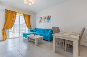 Appartement, plusieurs lits | Coin séjour