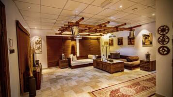 Royal Villa | Living area | 42-inch Smart TV with satellite channels, TV, fireplace