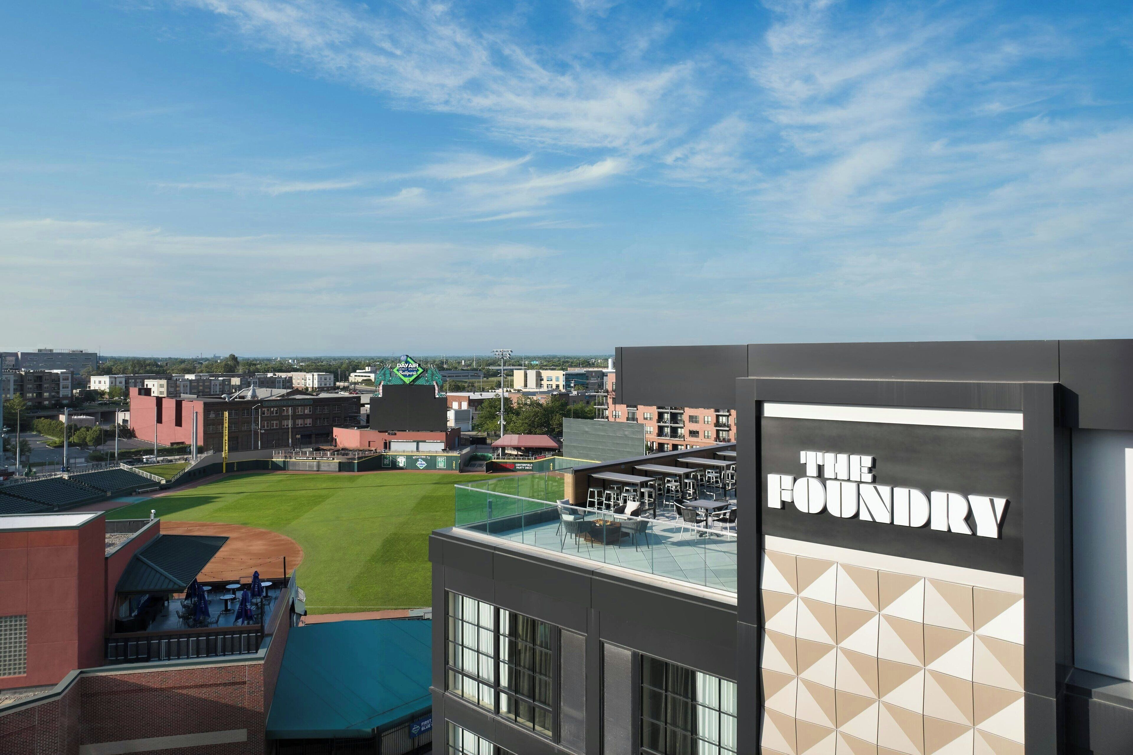 A view of a baseball field with a building labeled "The Foundry" in the foreground.