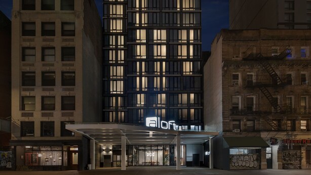 A modern hotel with a glass facade and a prominent 'Aloft' sign. - Aloft by Marriott New York Chelsea (New York)