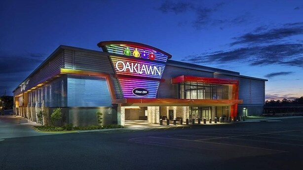 A modern building with a prominent sign reading "OAKLAWN" and "Since 1904". - Honeymoon in Hotsprings (Hot Springs)