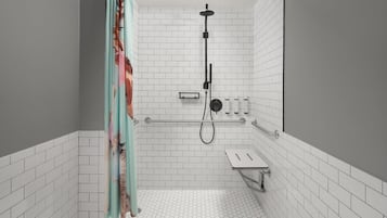 Un baño moderno con paredes de azulejos blancos, una ducha con manguera negra y un pequeño banco.