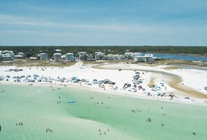 A coastal resort with multiple beachfront villas, a sandy beach, and clear turquoise waters. - NEW LISTING ★ WATERFRONT ★ FIREPIT (Vernon)