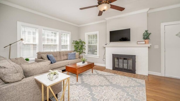 A living room with a sofa, coffee table, and fireplace. - 3 Bed 1.5 Bath Home By College Hill & Hospitals (Wichita)