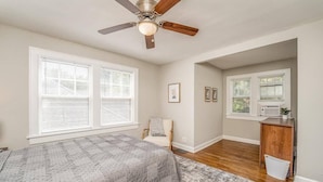 A bedroom with a bed, a chair, a desk, and a ceiling fan. - 3 Bed 1.5 Bath Home By College Hill & Hospitals (Wichita)