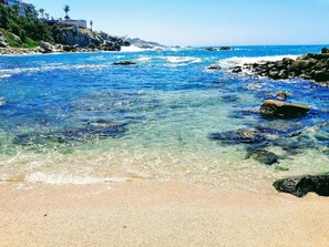 On the beach, sun-loungers, beach towels