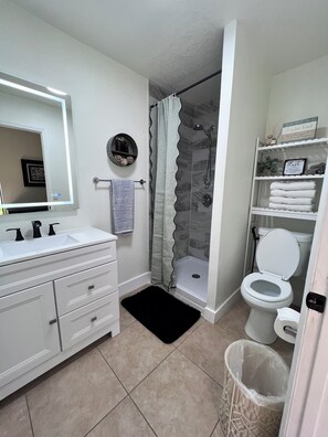 Shower, hair dryer, towels, soap