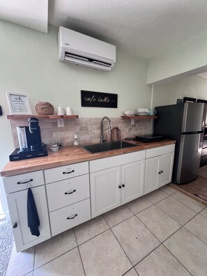 Fridge, microwave, coffee/tea maker, toaster