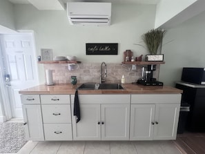 Fridge, microwave, coffee/tea maker, toaster