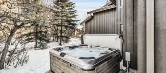 Mountain-view abode with a hot tub, scenic balcony, fireplaces, & free shuttle