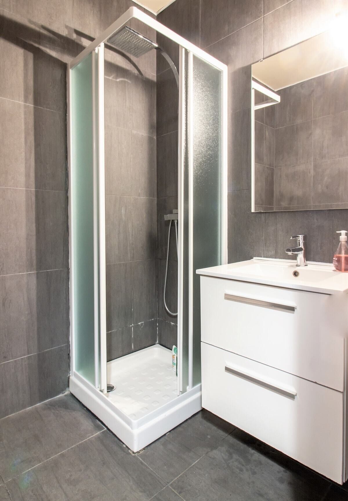 Shower, hair dryer, towels, soap