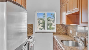 Apartment | Private kitchen | Full-size fridge, microwave, oven, stovetop