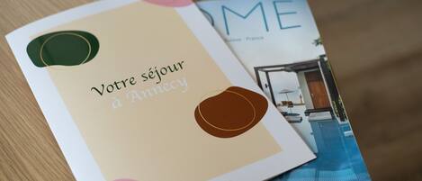 A brochure with text and a photo of a room.