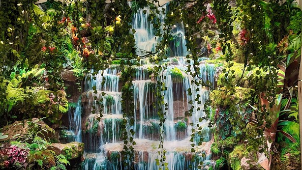 A hot tub with a waterfall backdrop, surrounded by lush greenery and plants. - NEW CABIN ~HOT TUB IN THEATER~1 QUIET ACRE ~HIKING ~FIRE PIT ~KING SUITES (Columbia)