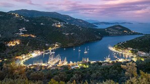 A coastal town with a marina, surrounded by hills and a bay. - Villa Roya in Sivota (Lefkada)