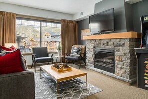 TV, fireplace - Your Lovely 3BR/2BA Condo at the Edge of Canmore (Dead Man`s Flats)