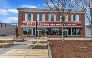 Outdoor dining - Sip, Stay, Play  Loft Above a Brewery (Myrtle Beach)