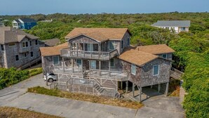 A multi-story house with a balcony and a garage. - Garbee-Patt - 6 BR Semi Oceanfront home w/Private Pool & Ocean View (Southern Shores)