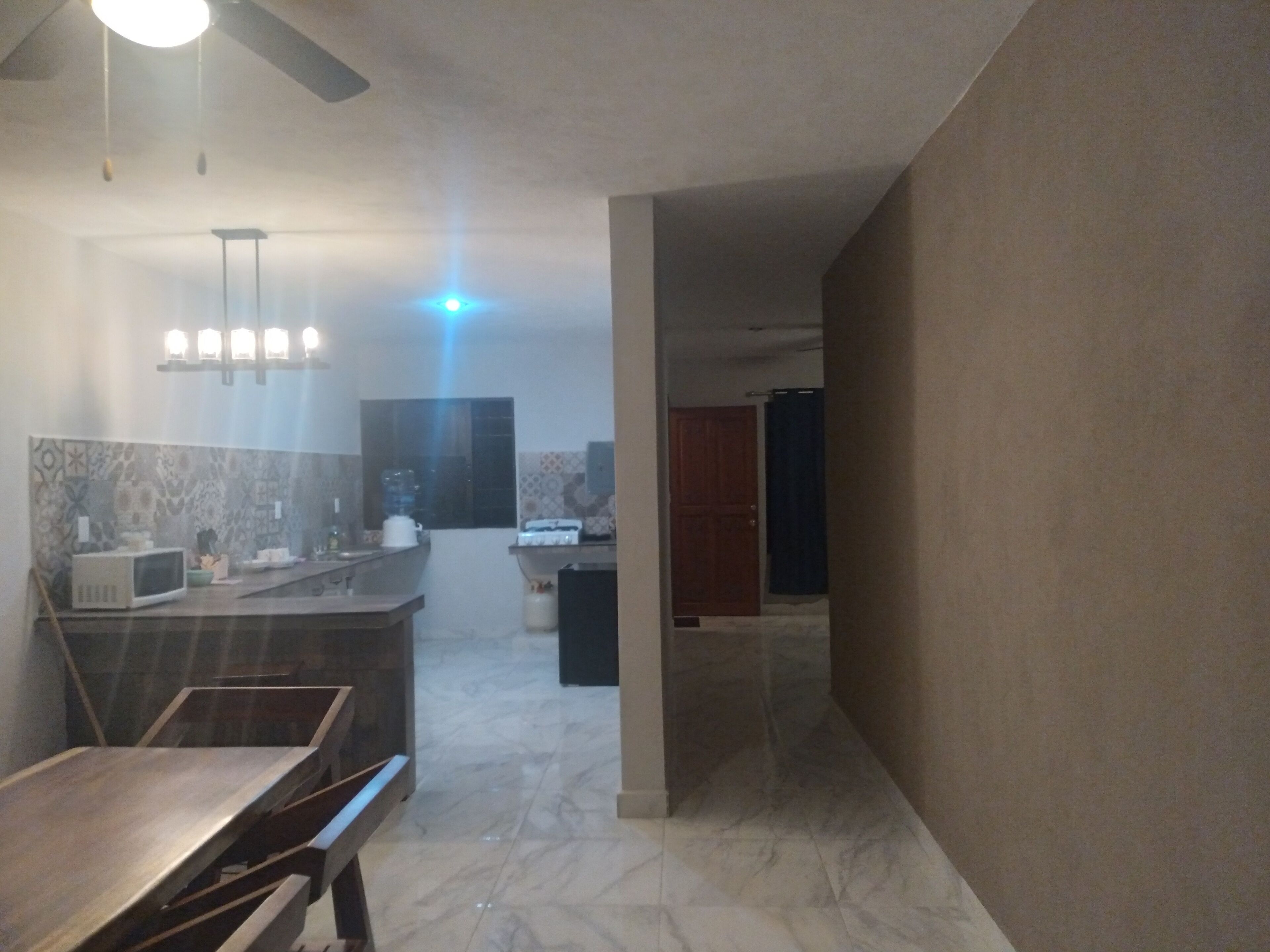 Fridge, microwave, cookware/dishes/utensils, dining tables