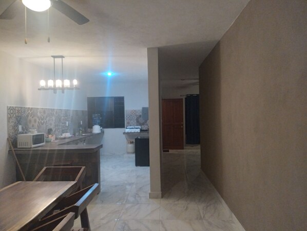 Fridge, microwave, cookware/dishes/utensils, dining tables