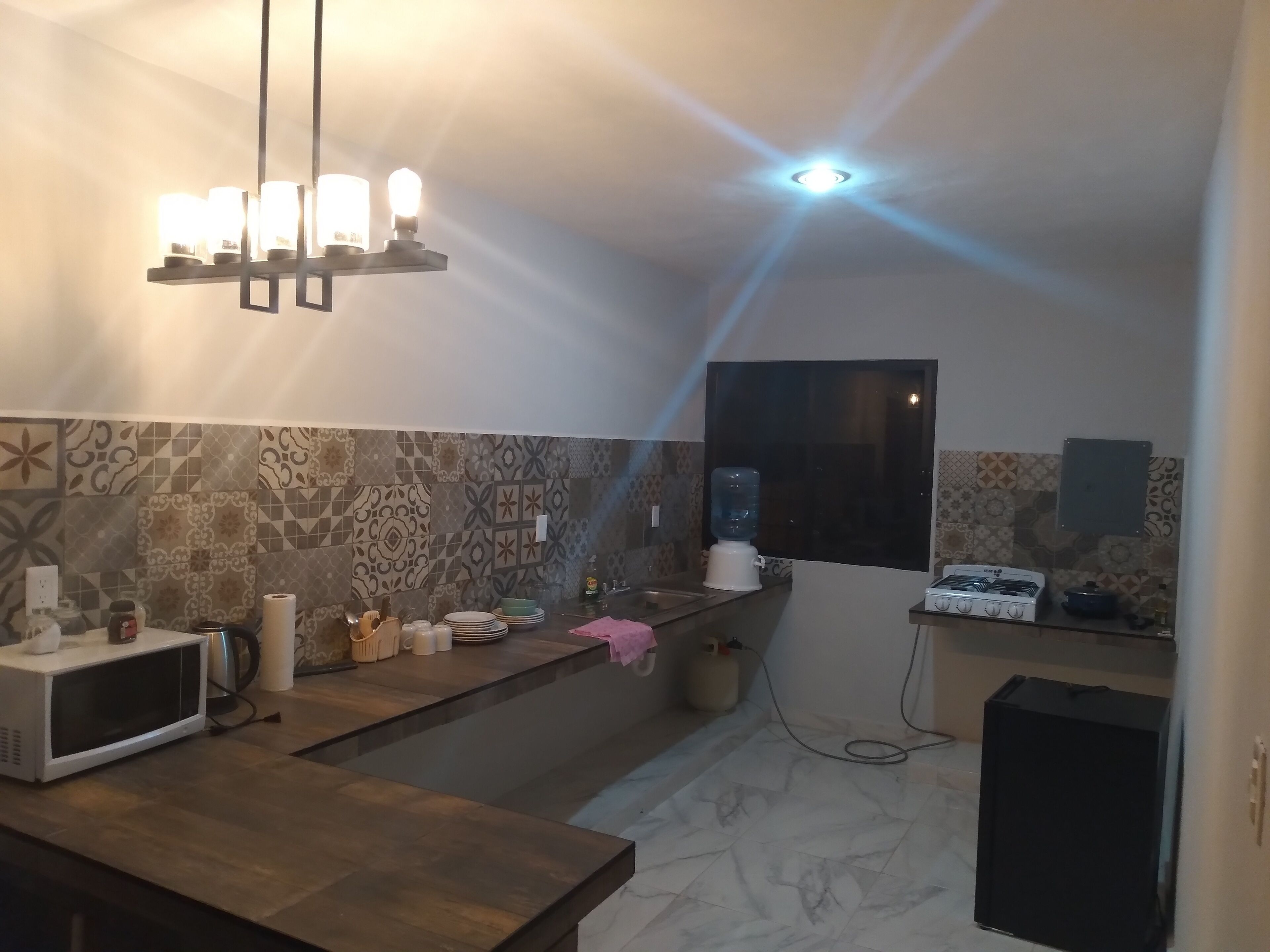 Fridge, microwave, cookware/dishes/utensils, dining tables