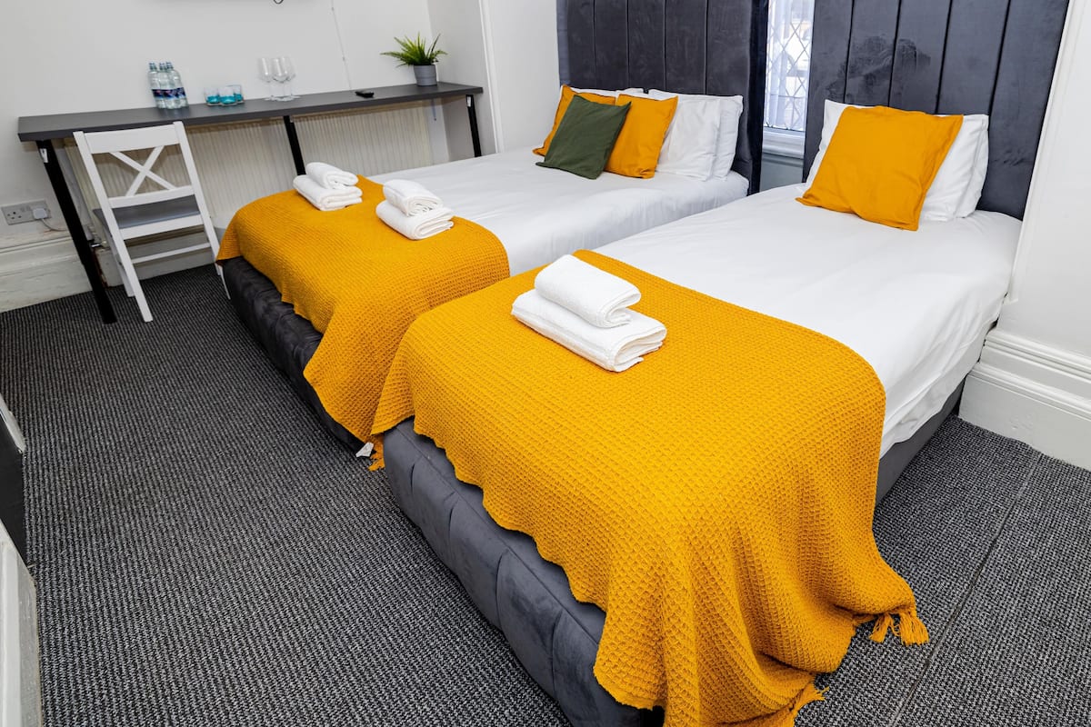Deluxe Triple Room | Peralatan tempat tidur hipoalergenik, kalis bunyi