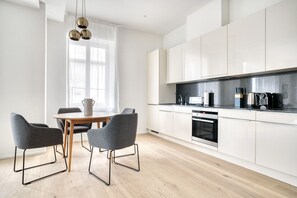 Fridge, microwave, oven, stovetop - Bright Wiedikon 3.5 Room w/ Storage & W/D, 3 min to Market, by Blueground (Zurich)