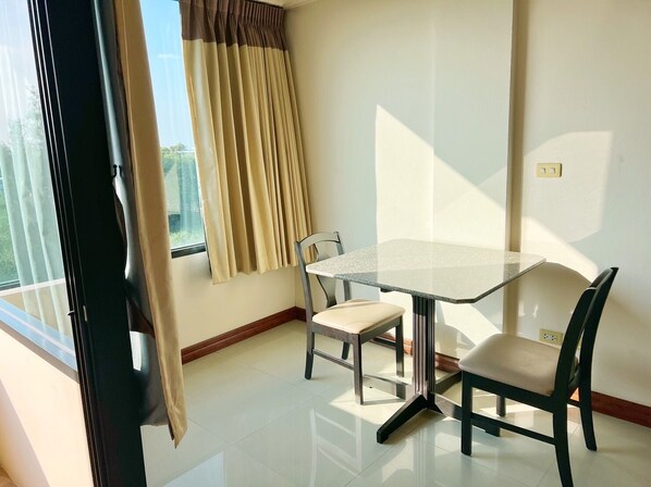 Hypo-allergenic bedding, desk, laptop workspace, blackout drapes