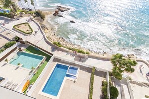 A heated pool, sun loungers