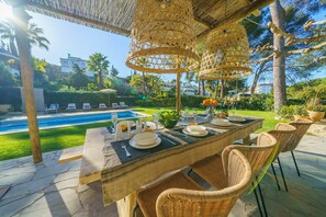 Outdoor dining - By The Sea | Beachfront Private Pool Stunning Garden AC Ideal for Families (Lloret de Mar)