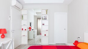 A modern bedroom with a bed, a desk, and a wardrobe. - A Pass by St. Peter's 121 (Roma)