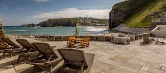 Luxury Beachfront cottage only 20 steps from the sand with private parking/patio