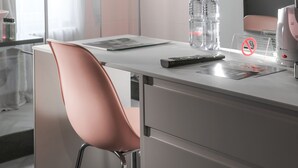 A modern hotel room with a desk, a chair, a television, and a shower area. - VISIONAPARTMENTS Zurich Brandschenkestrasse (Zürich)
