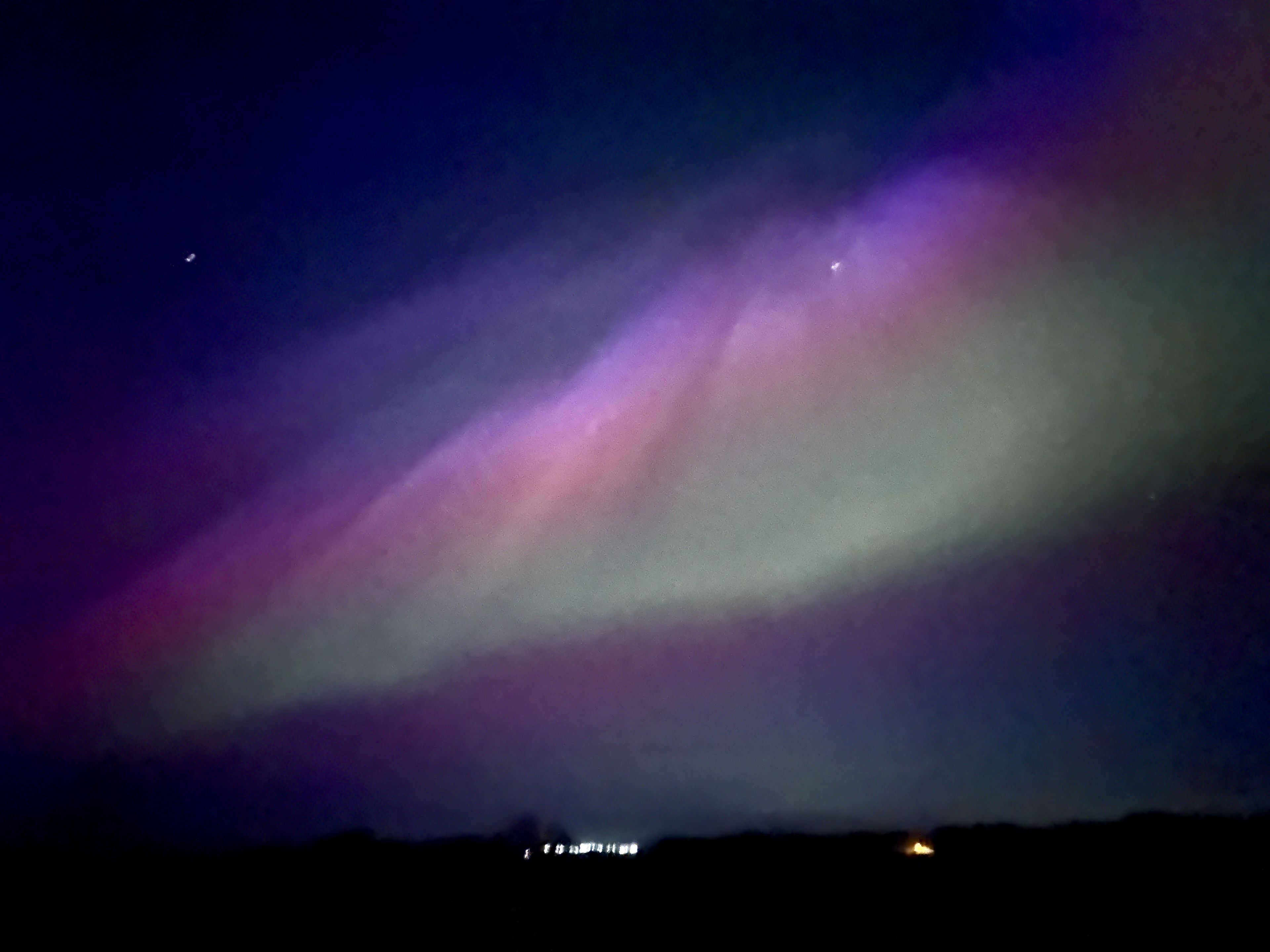 A night sky with aurora borealis.