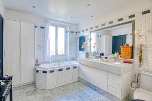 Shower, hair dryer, towels, toilet paper