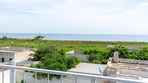 A coastal view with buildings and a clear sky. - 2 bedroom cozy home in Torre Chianca - Lecce (Torre Chianca - Lecce)