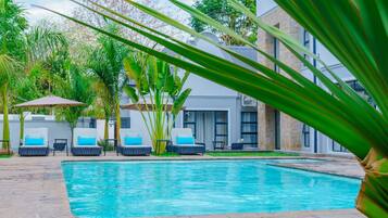 Outdoor pool, pool umbrellas, pool loungers